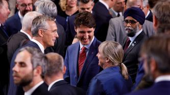 Prime Minister Trudeau talks with other NATO leaders.