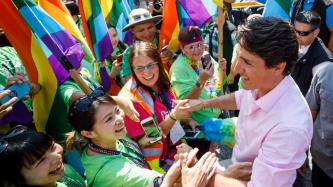 PM Trudeau shakes hands with people in a crowd
