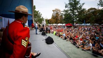 PM Trudeau addresses a crowd from an outdoor stage