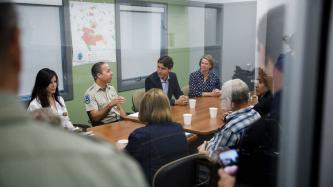 PM Trudeau listens to Officer Reinboldt during a meeting