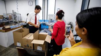 PM Trudeau listens to an entrepreneur
