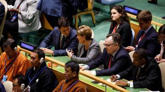 PM Trudeau listens to Minister Bibeau