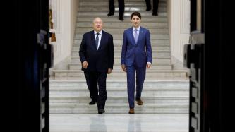 PM Trudeau and President Sarkissian walk down a set of stairs