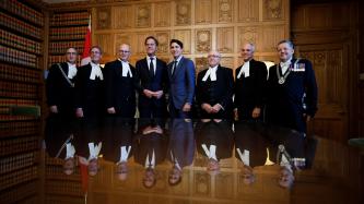 PMs Trudeau and Rutte take a photo with HoC and senate representatives