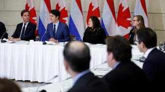PM Trudeau speaks during a meeting