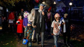 PM Trudeau and his family trick-or-treat while in costume  