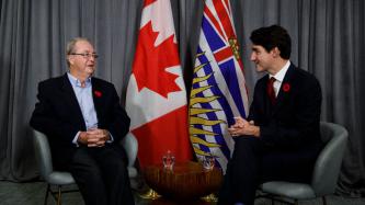 PM Trudeau sits and talks with Mayor McCallum