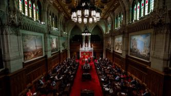 PM Trudeau speaks to attendees in the Senate Chamber
