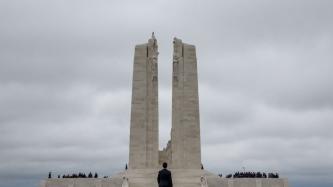 PM Trudeau walks towards the monument