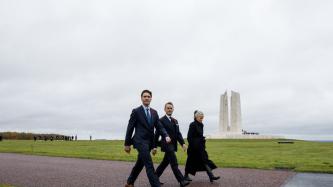 PM Trudeau, Minister O'Regan, and Ambassador Hudon walk down a pathway