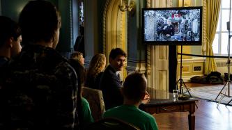 Astronaut David Saint-Jacques addresses a crowd via Television