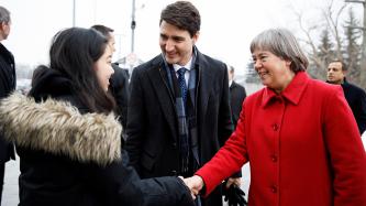 MP Schulte shakes hands with a woman