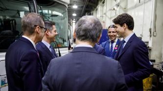 PM Trudeau laughs with Mayor Bowman and others