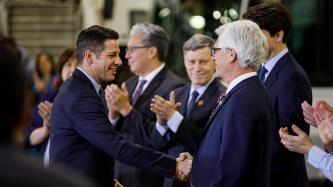 Mayor Bowman shakes hands with Minister Carr