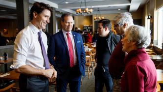 PM Trudeau and MP Fisher speak with restaurant customers