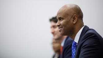 Minister Hussen smiles