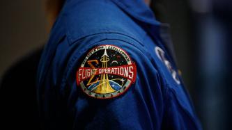 A close-up photo of the flight operations patch on a uniform