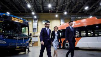 MP Omar Alghabra walks with Mayor Bonnie Crombie and PM Trudeau