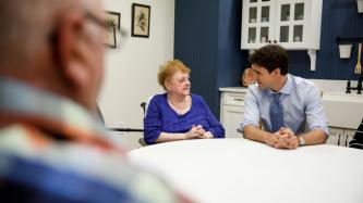 PM Trudeau listens to a resident speak