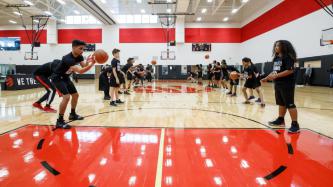 Clinic attendees take part in a basketball drill