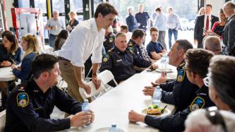 PM Trudeau speaks to a group of first responders