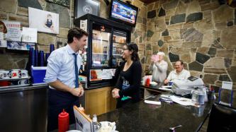 PM Trudeau speaks to a restaurant worker