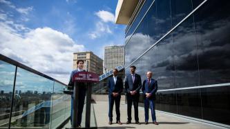 PM Trudeau stands at the podium