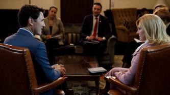 PM Trudeau and President Grabar-Kitarović sit in the meeting
