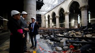Prime Minister Trudeau and others view the damage to Notre-Dame Cathedral 