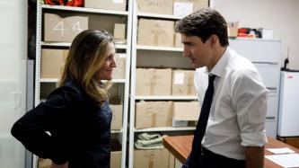 Minister Freeland and PM Trudeau converse with one another