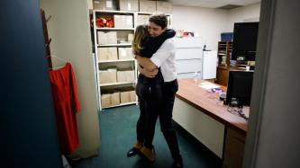 Minister Freeland and PM Trudeau hug each other