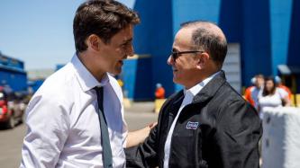 PM Trudeau and a Stelco Executive, Alan Kestenbaum speak with one another