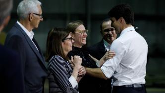 PM Trudeau and Minister Gould share a laugh