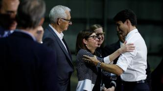 PM Trudeau and Minister Tassi share a smile