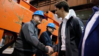 PM Trudeau shakes hands with an Algoma employee