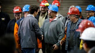 PM Trudeau shakes hands with an Algoma employee