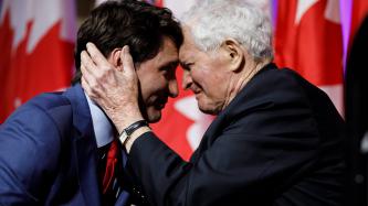 Former PM Turner hugs PM Trudeau
