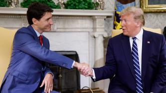 PM Trudeau shakes hands with President Trump