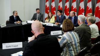 PM Trudeau speaks with municipal leaders during a roundtable
