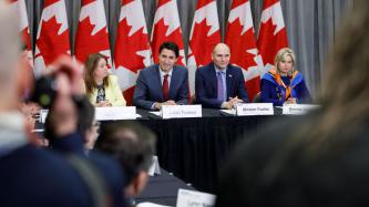 PM Trudeau listens during a roundtable