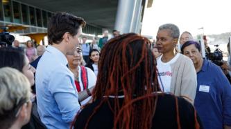 PM Trudeau speaks with a woman