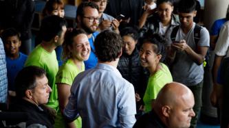 PM Trudeau speaks to a group of women
