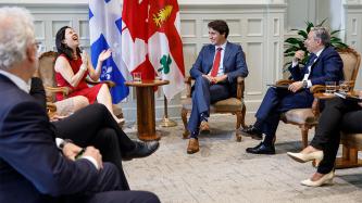 Prime Minister Trudeau and Minister Champagne laugh with the Mayor Valérie Plante
