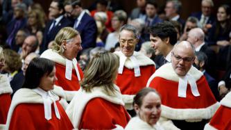 Prime Minister Trudeau and Supreme Court Judge Malcolm Rowe greet one another