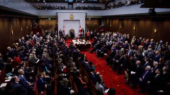 A full view of the Red Chamber and seated attendees