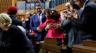 Anthony Rota hugs parliamentarian Yasmin Ratansi in the House of Commons