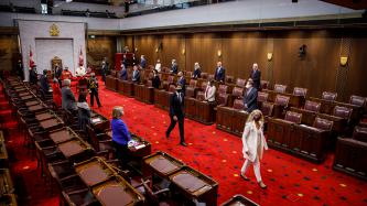 PM Trudeau and GG Julie Payette walk toward the exit of the Senate chamber