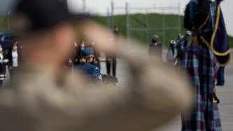 A service hat is carried by a military member