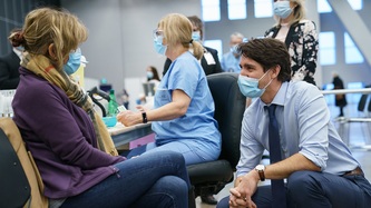 PM Trudeau speaks with a woman