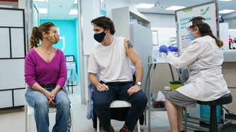 Prime Minister Trudeau and Sophie Grégoire Trudeau sit looking at one another